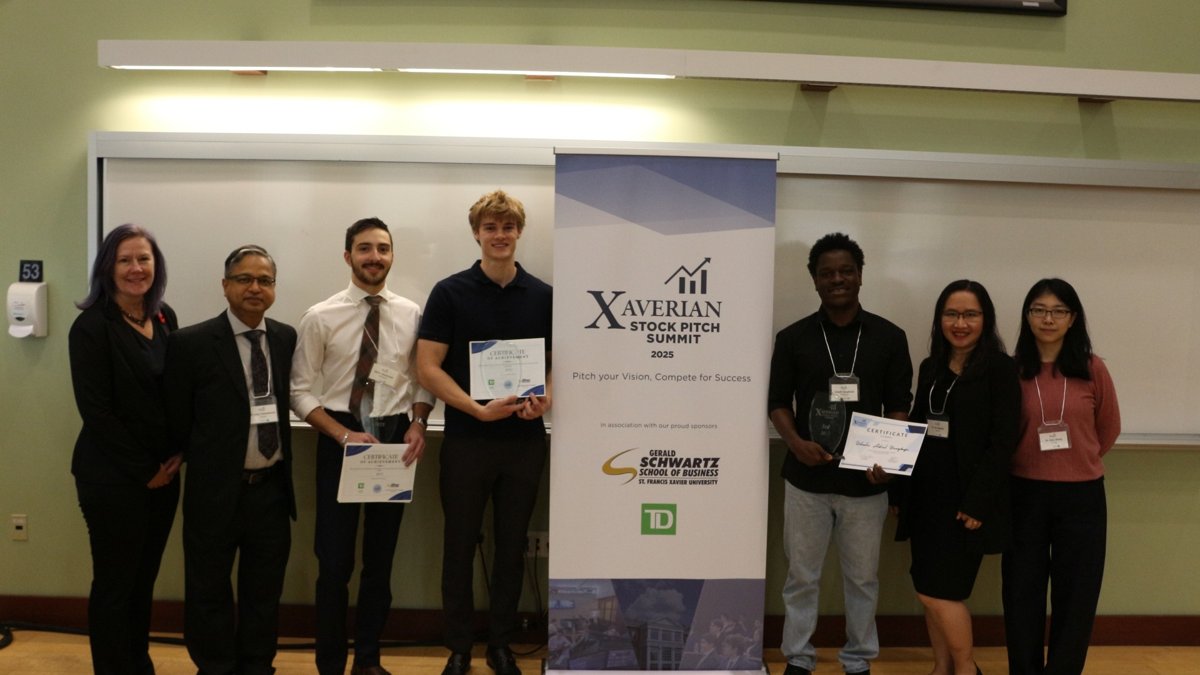 Winners of the Xaverian Stock Pitch Competition with faculty and judges